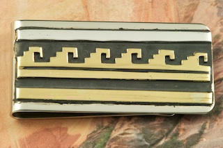 Beautiful Gold fill Pueblo Design on oxidized Sterling Silver set on a Nickel Silver Money Clip. Created by Navajo Artist Tommy Singer.